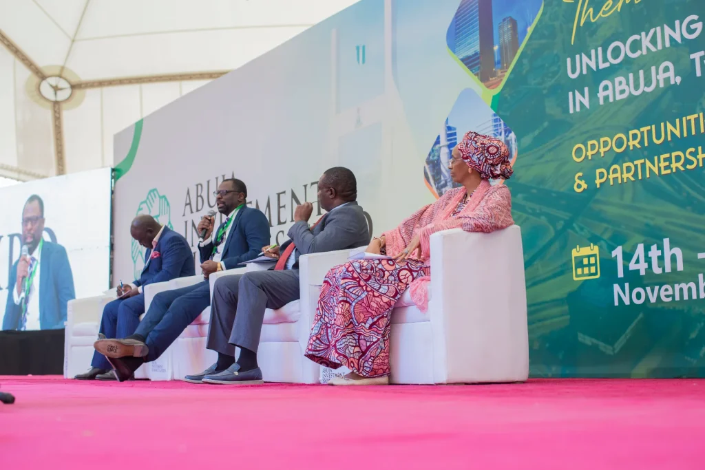 Panellists seated on the summit stage